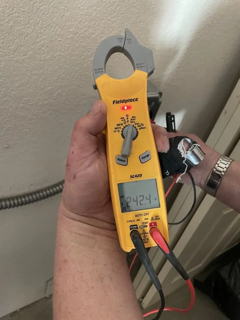 Voltage testing with clamp meter during Ceiling Fan Installation in Bedford